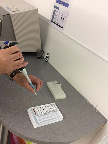 Pipetting blood into reagent strips